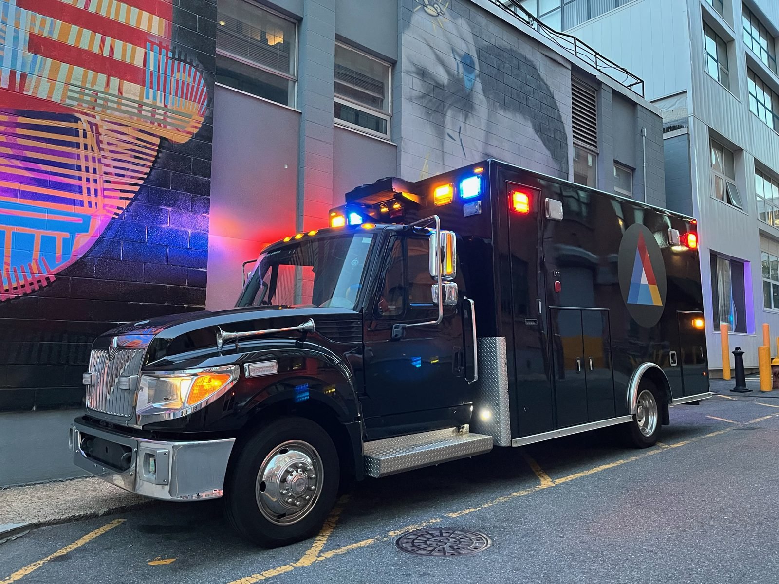 The SIC TANK LIVE broadcast truck with its lights on